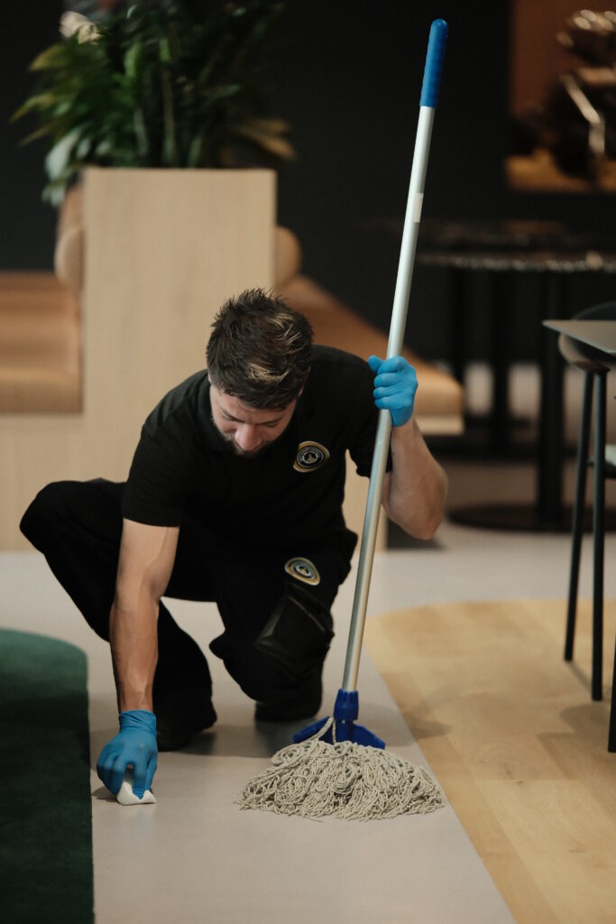 Oscar Cleaning Services operative cleaning an office floor in London